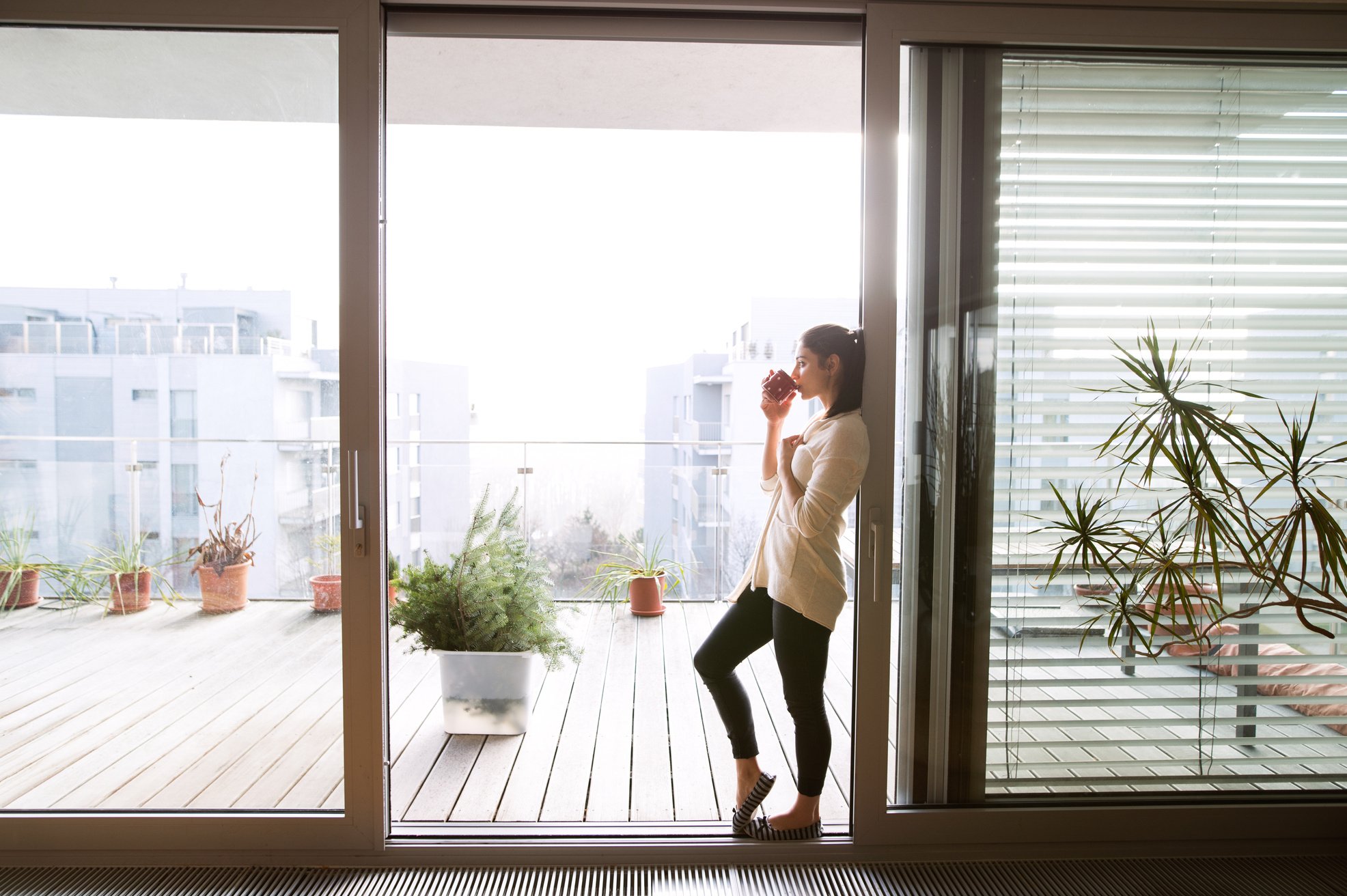 Woman Relaxing on Balcony